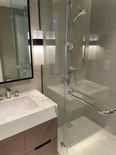 a bathroom with a glass shower and a sink at Sharm 3 Bedroom Luxury Apartment in Sharm