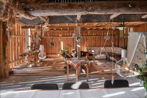 a room with chairs and a stage with wooden walls at Kotula in AdamÃ³w