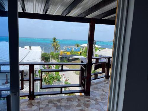 a view of the ocean from the balcony of a house at Posada Ashanty in Providencia