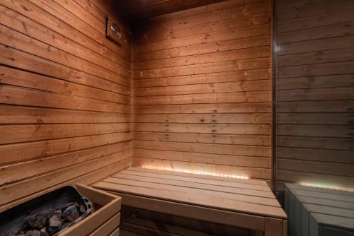 an empty wooden sauna with a bench in it at Eurostars Santa Luzia in Guimarães