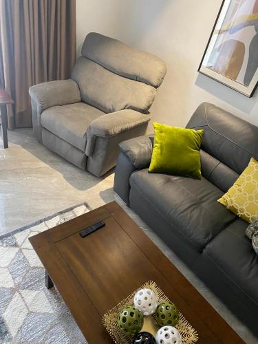 a living room with a couch and a table at Walking Street Condo Beautiful 1 king bedroom in Angeles