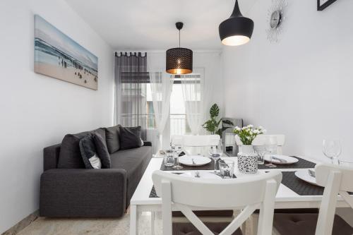 Posedenie v ubytovaní Kapitański Mostek Apartments Kołobrzeg by Noclegi Renters