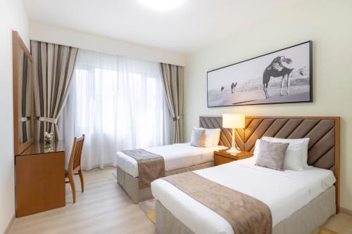 Postel nebo postele na pokoji v ubytování Golden Sands Suites
