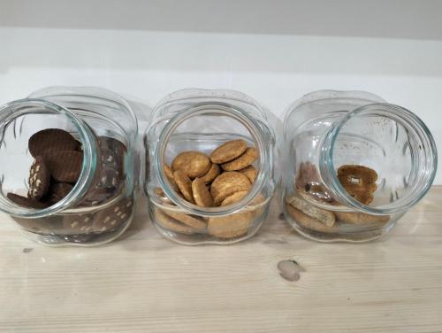 three glass jars filled with different types of nuts at La Trinacria di Capo Passero in Portopalo