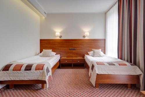 Postel nebo postele na pokoji v ubytování Hotel Gromada Warszawa Centrum
