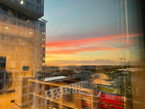 a view of a sunset from a building at Fabulous Morden Apartment in Helsinki in Helsinki