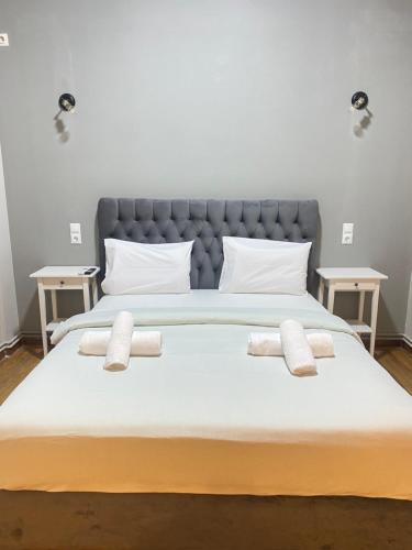 a large bed with two pillows on top of it at Athens City Themis13 in Athens