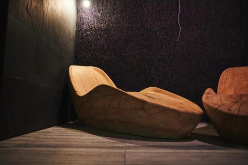a wooden bowl sitting on the floor in a room at Crona SPA Karpaty in Skhidnitsa