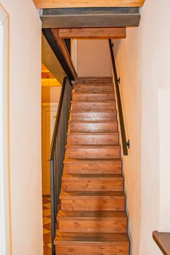 a staircase in a house with wooden floors at Hotel Capitelli in Trieste