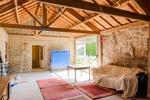 a room with a bed and a table in it at Degemer mat dans cette maison familiale ! in Loctudy