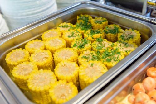a tray of muffins with broccoli on top at Primavera Jastrzębia Góra in Jastrzębia Góra