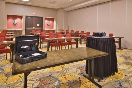 a conference room with tables and chairs in it at Crowne Plaza Shenandoah - The Woodlands Area by IHG in The Woodlands