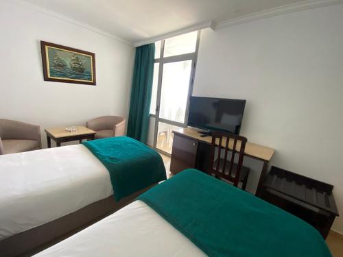 Una cama o camas en una habitación de Hotel Azur