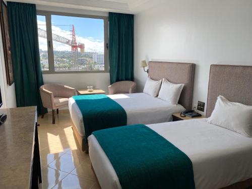 Una cama o camas en una habitación de Hotel Azur
