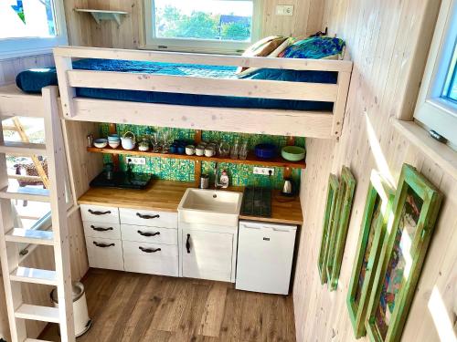 a small kitchen in a tiny house at Bohemian Eco lodge át lake Balaton in Kisapáti