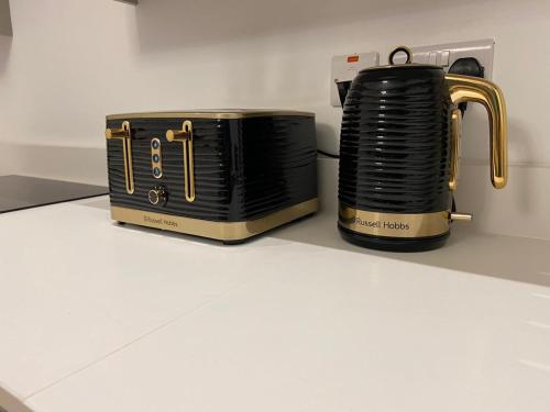 a black and gold toaster sitting on a counter at Apartment 5 4 bedrooms, sleeps x 15 in York
