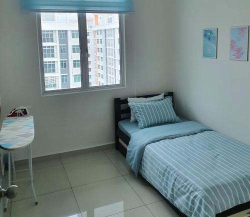 Ένα ή περισσότερα κρεβάτια σε δωμάτιο στο D' Homestay Meru Ipoh - Free WiFi
