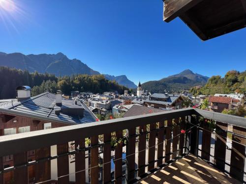 a view of a city from a balcony at Hotel Giardino in Pieve di Cadore