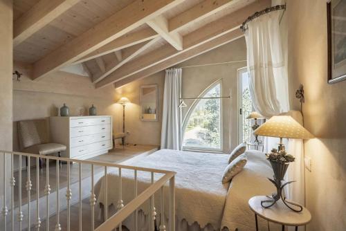 Postel nebo postele na pokoji v ubytování Guadalupe Tuscany Resort