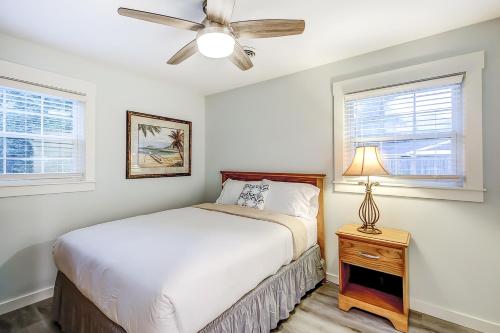 a bedroom with a bed and a ceiling fan at Pleasant Dreams in Charleston