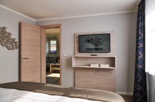 TV o dispositivi per l'intrattenimento presso R&R Strandhotel Baabe