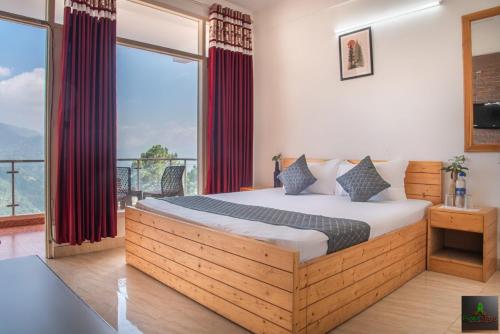 a bedroom with a large bed and a large window at Exotic Stays I The Kasauli Western Uphills I Vacations I Family Groups & Events I Forest Treks I Memories I Serviced Apartments I Kasauli in Kasauli
