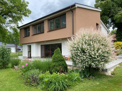 a house with a garden in front of it at Residence Dymokury in Dymokury