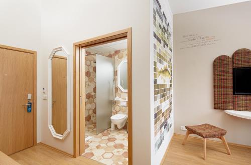 a bathroom with a shower and a toilet at Reykjavik Marina - Berjaya Iceland Hotels in Reykjavík