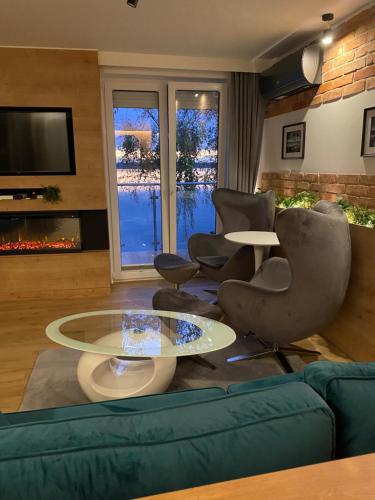 Posedenie v ubytovaní Apartament MoLoo III