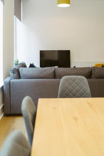 a living room with a couch and a table at Apartment 1 2 bedrooms, sleeps x 6 in York