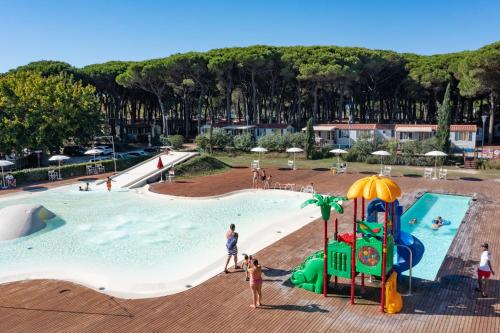 a group of people playing in a pool at a resort at Pineta Sul Mare Camping Village in Cesenatico