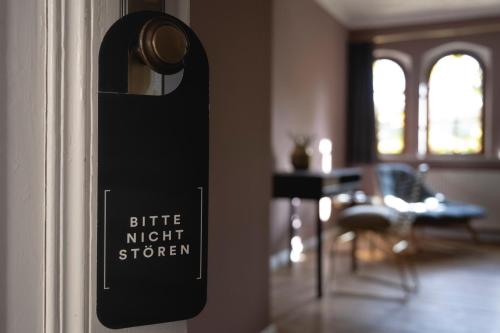 a door with a sign that reads elite night station at Hotel Schloss Neetzow in Neetzow