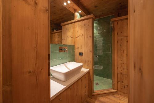 a bathroom with a toilet and a sink and a shower at Casa Betulla in Cortina dʼAmpezzo