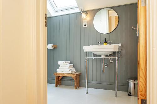 a bathroom with a sink and a mirror at The Roost in Westport