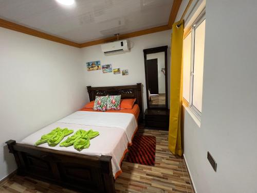 a bedroom with a bed with bananas on it at Posada Ashanty in Providencia