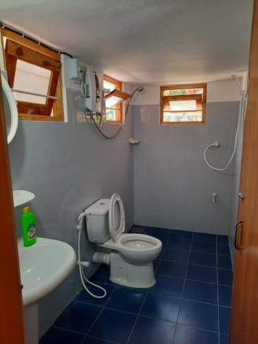 a bathroom with a toilet and a sink at 1906 Park View in Anuradhapura