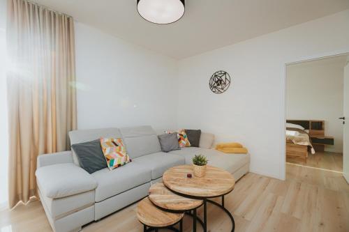 a living room with a couch and a table at Apartmán BALIN X31 in Dolný Kubín