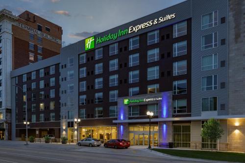 a building with cars parked in front of it at Holiday Inn Express & Suites - Lincoln Downtown by IHG in Lincoln