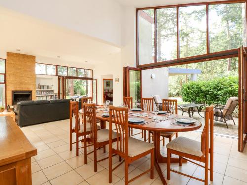 a dining room with a table and chairs at 1 Aleutia Gardens in Thetford