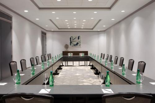 a conference room with a long table and chairs at Crowne Plaza College Park - Washington DC by IHG in Greenbelt