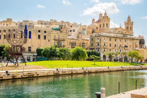 a view of a city with a river and buildings at Casa Maria Tereza in Cospicua