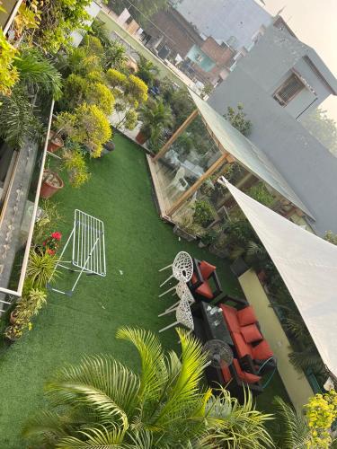 an aerial view of a yard with a white iron gate at GREEN HOME STAY in Lucknow