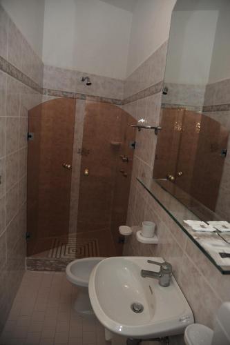 a bathroom with a sink and a shower at Hotel Baia Marina in Cattolica