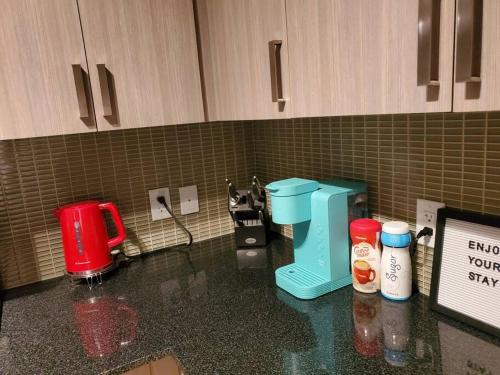 a kitchen counter with a coffee maker on a counter top at Midtown 4 bedroom home Free Wi-Fi and parking in Toronto