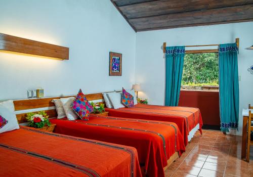 Ένα ή περισσότερα κρεβάτια σε δωμάτιο στο Hotel Panchoy by AHS