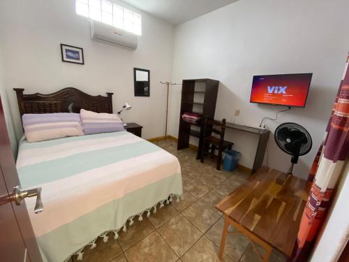 Ein Bett oder Betten in einem Zimmer der Unterkunft Hostal Mixteco Naba Nandoo