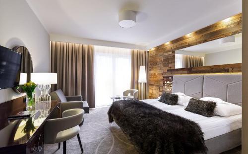 Posteľ alebo postele v izbe v ubytovaní Sandra Spa Karpacz & Aquapark