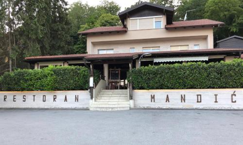 a house with a sign that reads regional istg at Apartman LELA in Karlovac