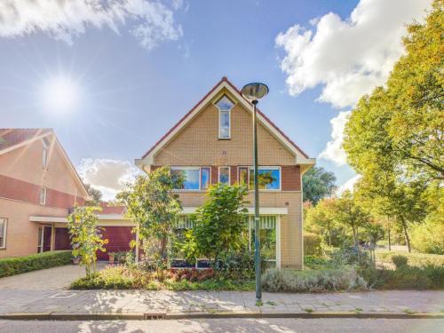 a house with a street light in front of it at Comfy holiday home in Hoorn with French balcony in Hoorn