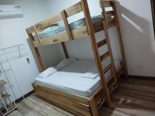 a couple of bunk beds in a room at Casa Linda in Uvita